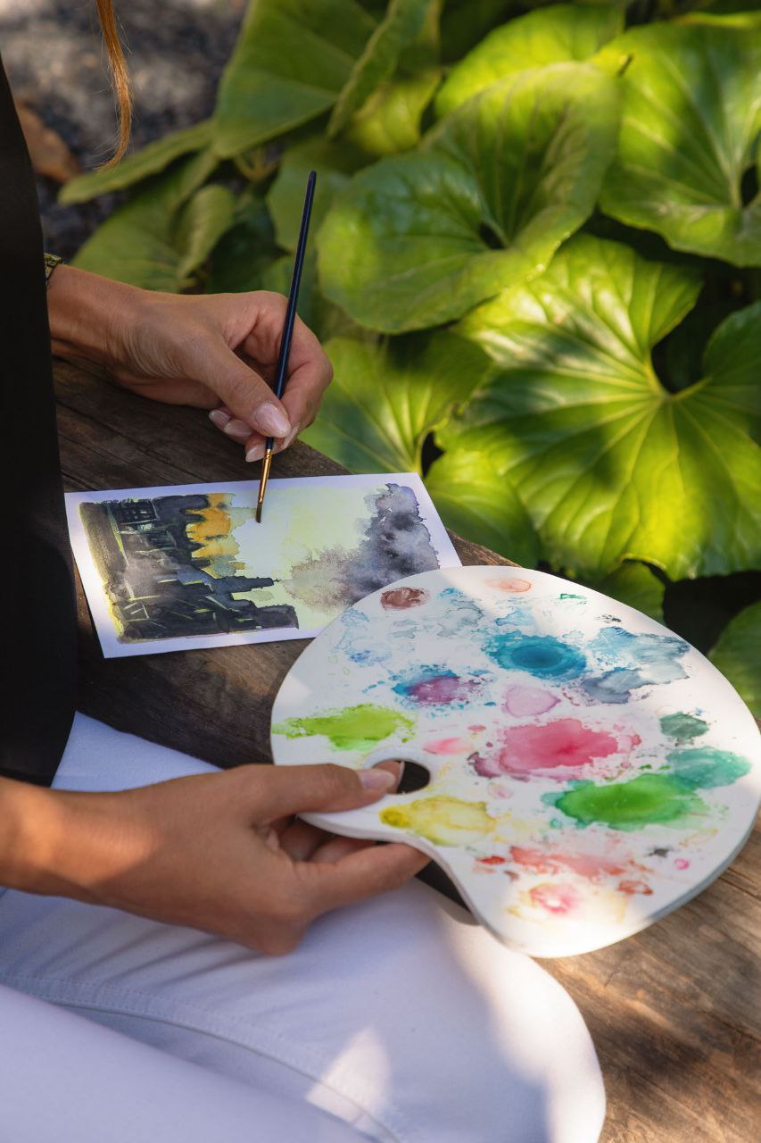 Marie painting a watercolor